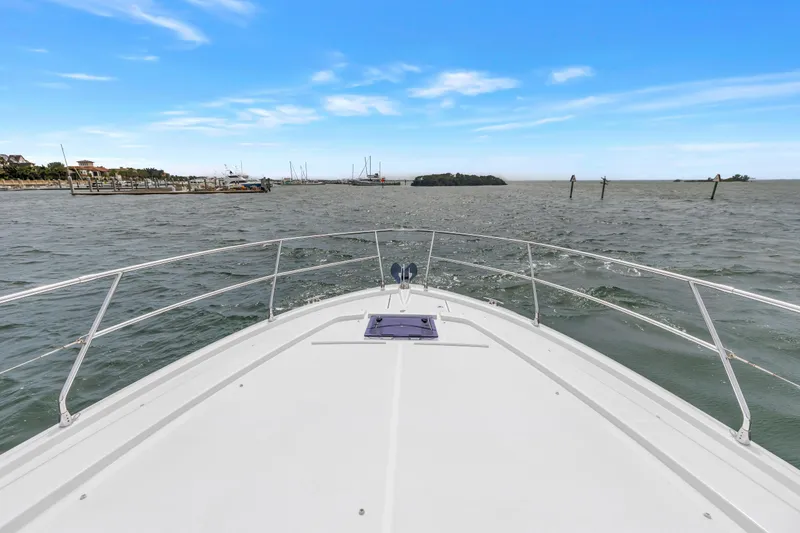 Slide: The Image of Bow view of 2019 Beneteau Gran Turismo 46 cruising on open water. - 20