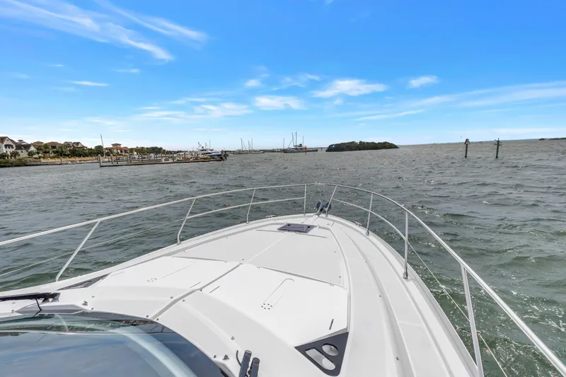 Slide: The Image of 2019 Beneteau Gran Turismo 46 cruising on open water under a clear blue sky. - 21