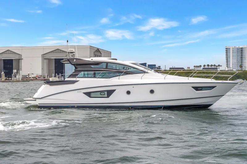 Slide: The Image of 2019 Beneteau Gran Turismo 46 yacht cruising on water near marina. - 3