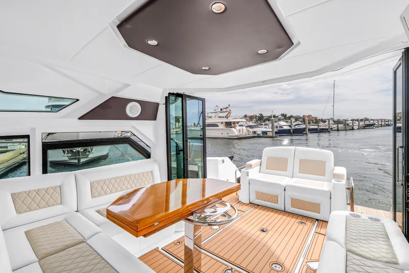 Slide: The Image of Luxurious interior of 2019 Beneteau Gran Turismo 46 yacht with elegant seating and waterfront view. - 31