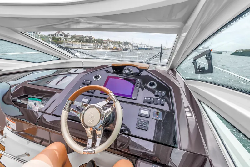 Slide: The Image of Cockpit view of 2019 Beneteau Gran Turismo 46 yacht with modern controls and steering wheel. - 37
