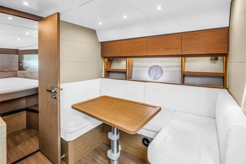 Slide: The Image of Luxurious interior of 2019 Beneteau Gran Turismo 46 yacht with elegant seating and wooden finishes. - 43