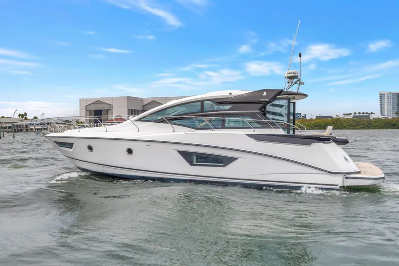 Slide: The Image of 2019 Beneteau Gran Turismo 46 yacht cruising on water under clear blue sky. - 5