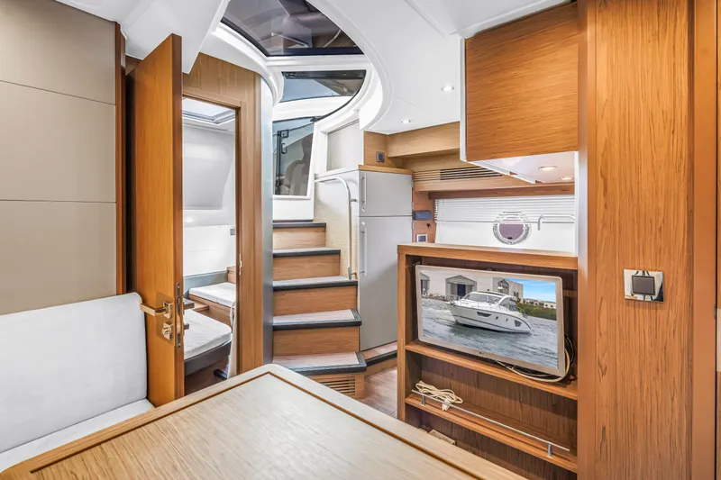 Slide: The Image of Luxurious interior of 2019 Beneteau Gran Turismo 46 yacht with modern wood finishes. - 52
