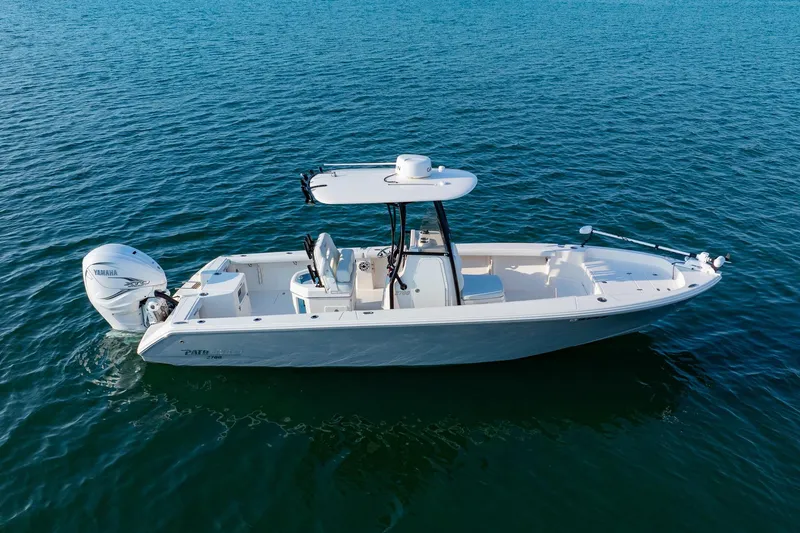 Slide: The Image of 2023 Pathfinder 2700 Open boat on calm blue water, featuring a Yamaha outboard motor. - 11