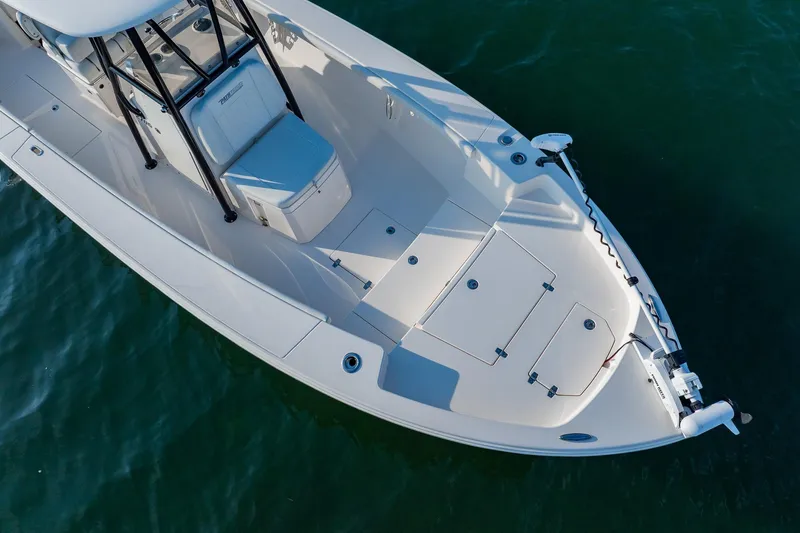 Slide: The Image of 2023 Pathfinder 2700 Open boat on water, showcasing sleek design and spacious deck. - 13