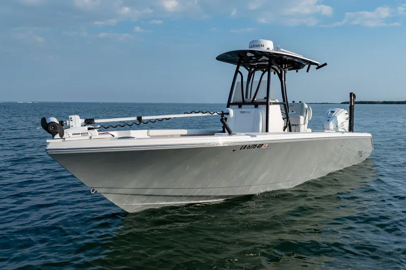 Slide: The Image of 2023 Pathfinder 2700 Open boat on calm water under a clear sky. - 15