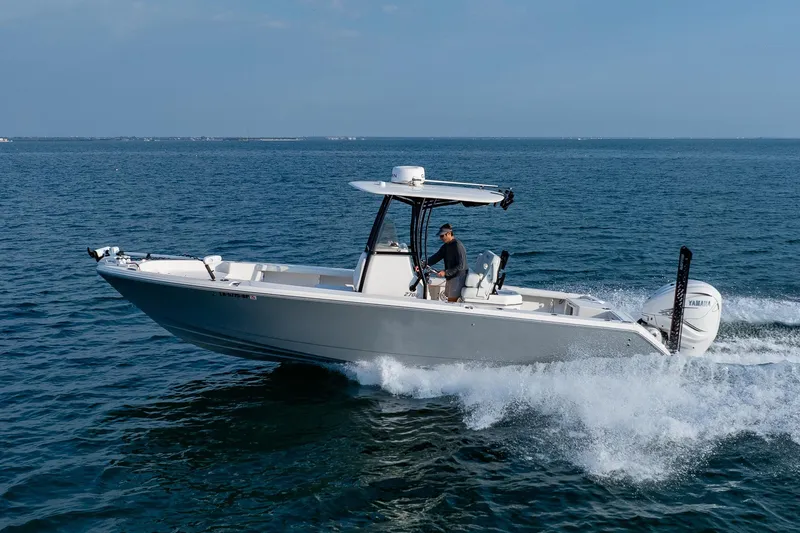 Slide: The Image of 2023 Pathfinder 2700 Open boat cruising on open water, side view. - 18