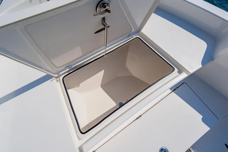 Slide: The Image of Open storage compartment on 2023 Pathfinder 2700 Open boat, showcasing spacious interior. - 26