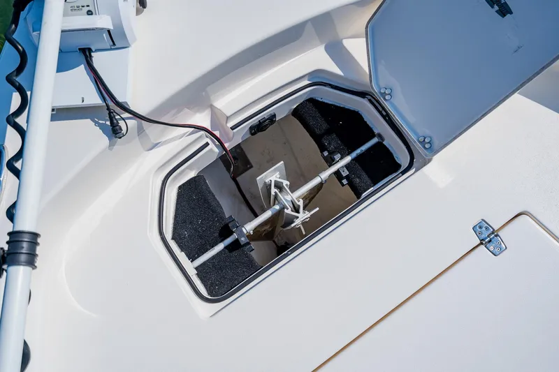 Slide: The Image of Open hatch on 2023 Pathfinder 2700 Open boat showing anchor storage. - 27
