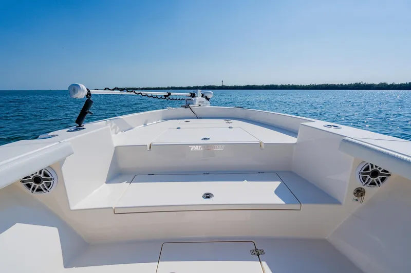 Slide: The Image of 2023 Pathfinder 2700 Open boat on calm water, showcasing spacious deck and modern design. - 32