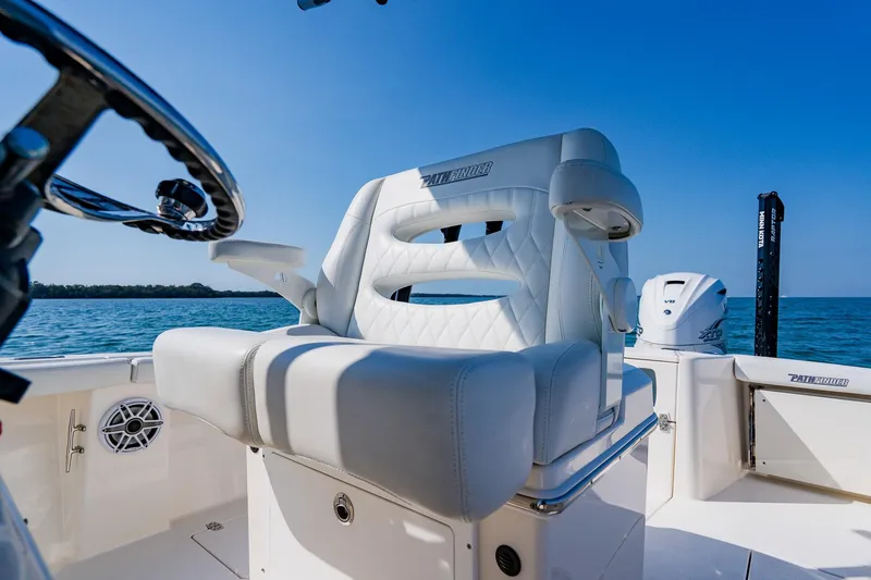 Slide: The Image of 2023 Pathfinder 2700 Open boat interior with luxurious seating and ocean backdrop. - 39