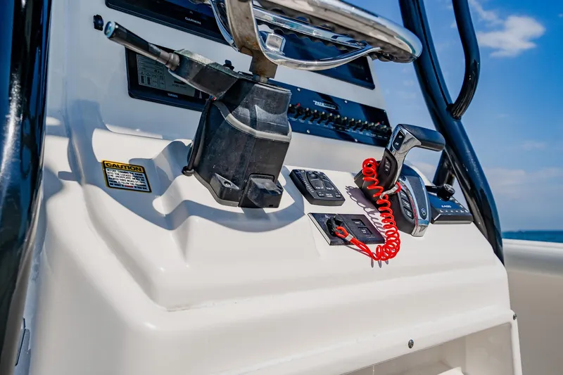 Slide: The Image of 2023 Pathfinder 2700 Open boat console with steering wheel and controls. - 43