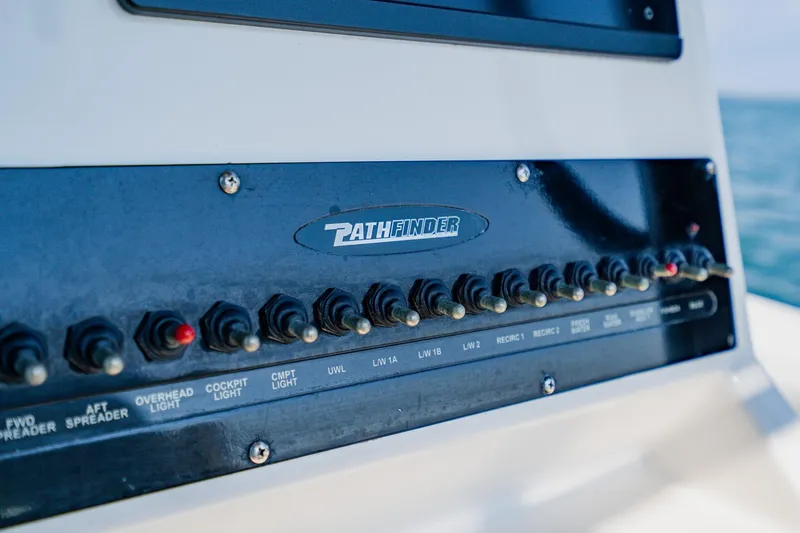 Slide: The Image of Control panel of 2023 Pathfinder 2700 Open boat with labeled switches. - 45
