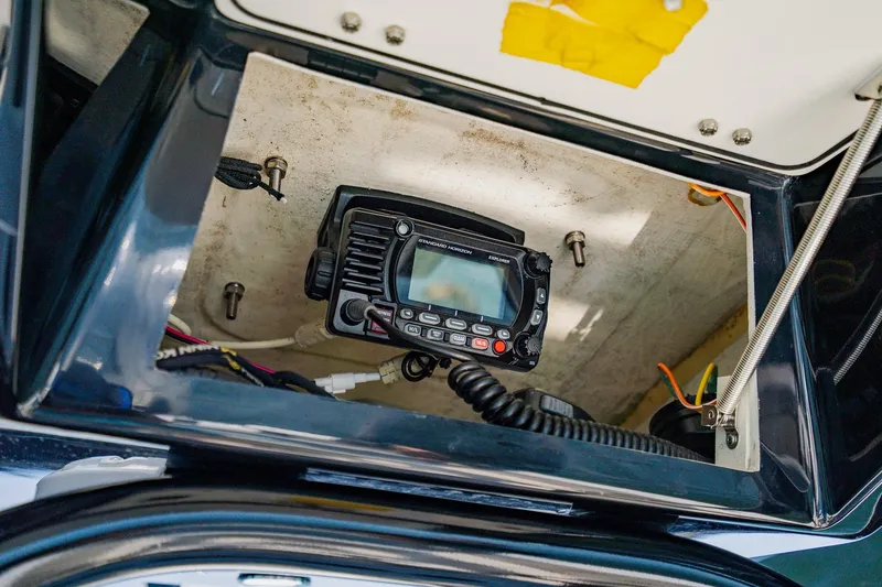 Slide: The Image of 2023 Pathfinder 2700 Open boat radio compartment with communication equipment. - 47