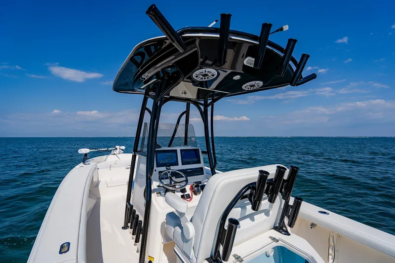 Slide: The Image of 2023 Pathfinder 2700 Open boat on open water, featuring sleek design and modern equipment. - 48