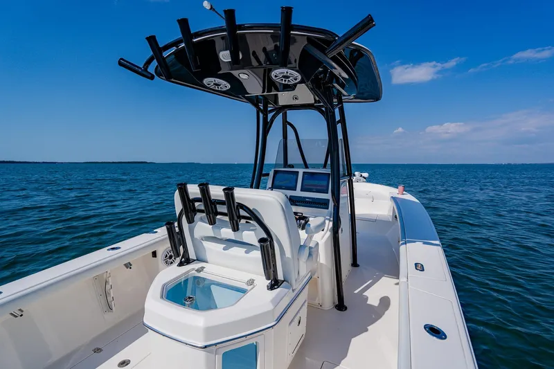 Slide: The Image of 2023 Pathfinder 2700 Open boat on calm blue water under clear sky. - 50