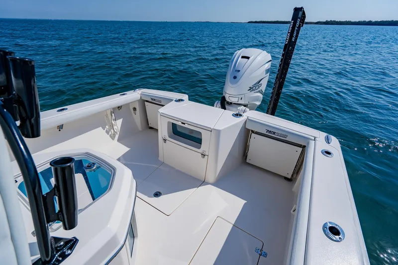 Slide: The Image of 2023 Pathfinder 2700 Open boat on water, featuring spacious deck and powerful engine. - 53