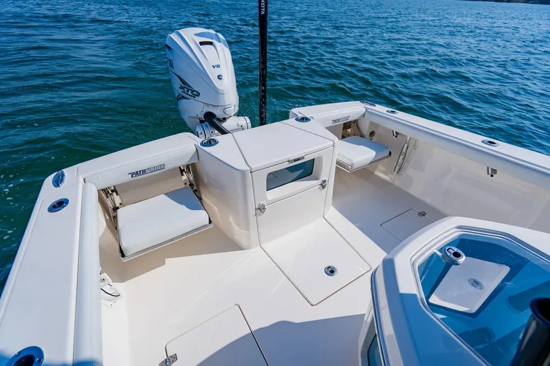 Slide: The Image of 2023 Pathfinder 2700 Open boat interior with seating and Yamaha outboard motor on water. - 56