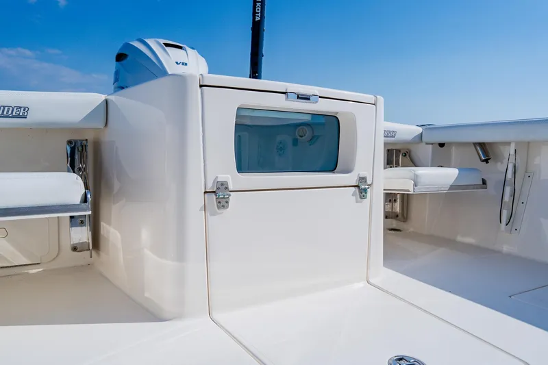 Slide: The Image of 2023 Pathfinder 2700 Open boat interior with seating and storage compartments. - 57