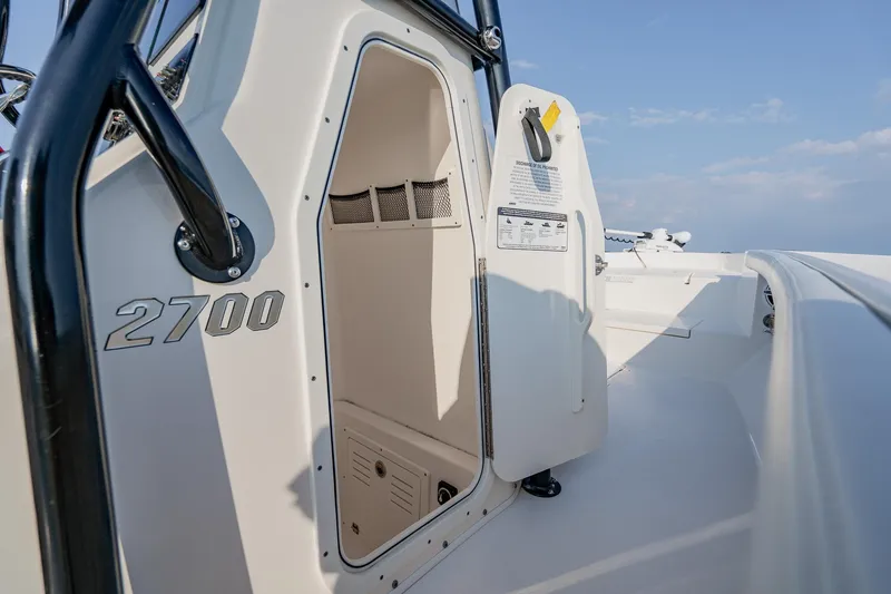 Slide: The Image of 2023 Pathfinder 2700 Open boat interior with open compartment door. - 62
