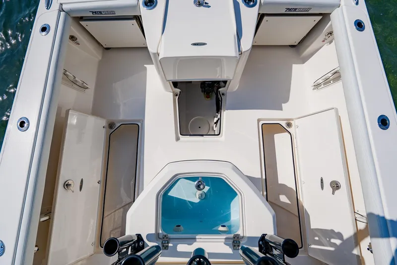Slide: The Image of 2023 Pathfinder 2700 Open boat interior with storage compartments and seating. - 64