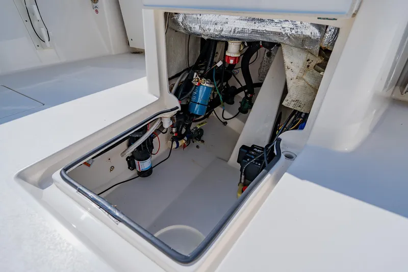 Slide: The Image of 2023 Pathfinder 2700 Open boat compartment showcasing internal wiring and components. - 67