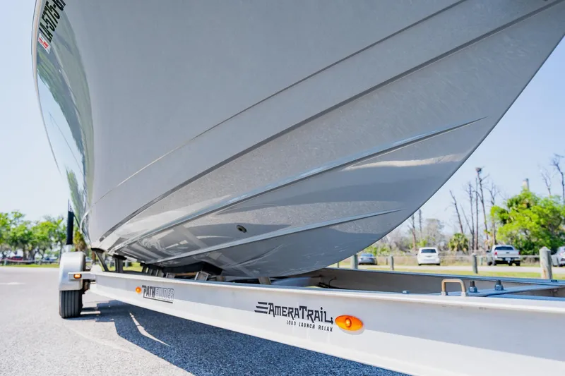 Slide: The Image of 2023 Pathfinder 2700 Open boat on trailer, showcasing sleek hull design. - 7