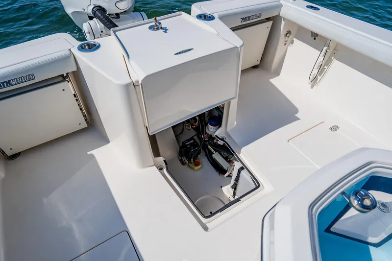 Slide: The Image of 2023 Pathfinder 2700 Open boat interior with storage compartments and equipment access. - 70