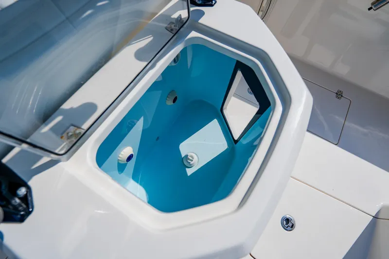 Slide: The Image of Livewell compartment on 2023 Pathfinder 2700 Open boat, featuring a sleek design. - 72