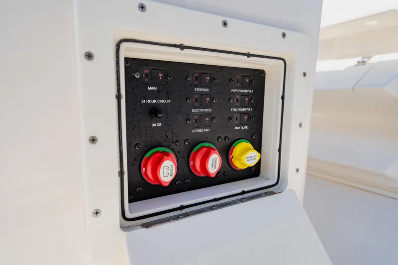 Slide: The Image of Control panel of 2023 Pathfinder 2700 Open boat, featuring switches and emergency controls. - 77