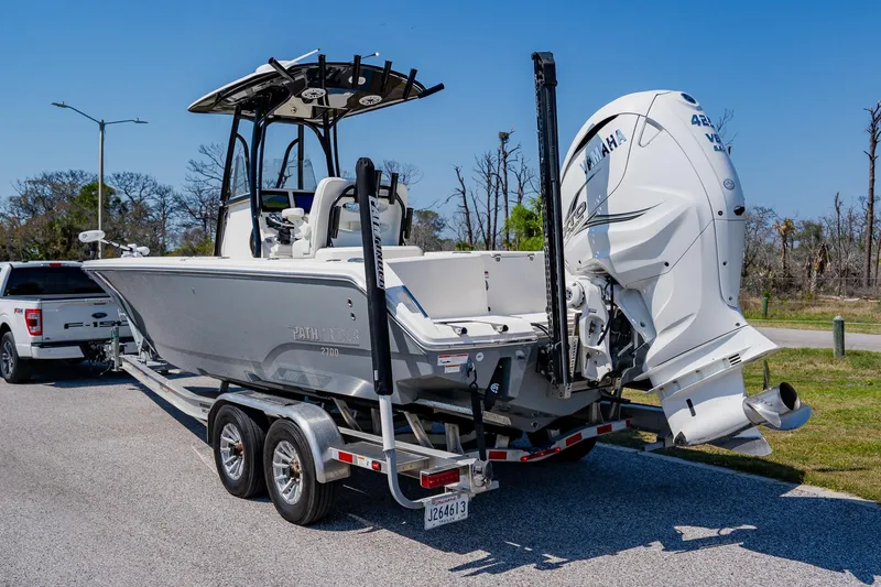 Slide: The Image of 2023 Pathfinder 2700 Open boat on trailer with Yamaha engine, parked outdoors. - 8