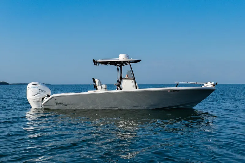 Slide: The Image of 2023 Pathfinder 2700 Open boat on calm blue water under clear sky. - 9