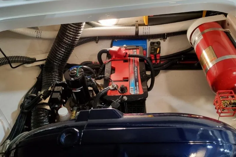 Slide: The Image of Engine compartment of a 2026 Formula 240 Bowrider with battery and fire extinguisher. - 20