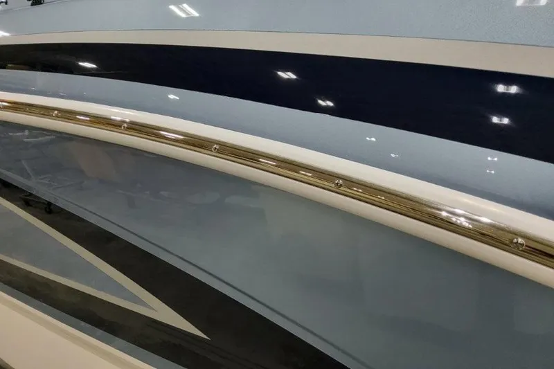 Slide: The Image of 2026 Formula 240 Bowrider boat hull with sleek blue and white design. - 4