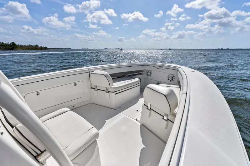 Slide: The Image of 2015 Jupiter 34 HFS boat interior with seating, on a sunny day at sea. - 11