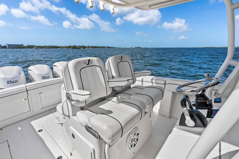 Slide: The Image of 2015 Jupiter 34 HFS boat interior with helm, seating, and ocean view. - 17