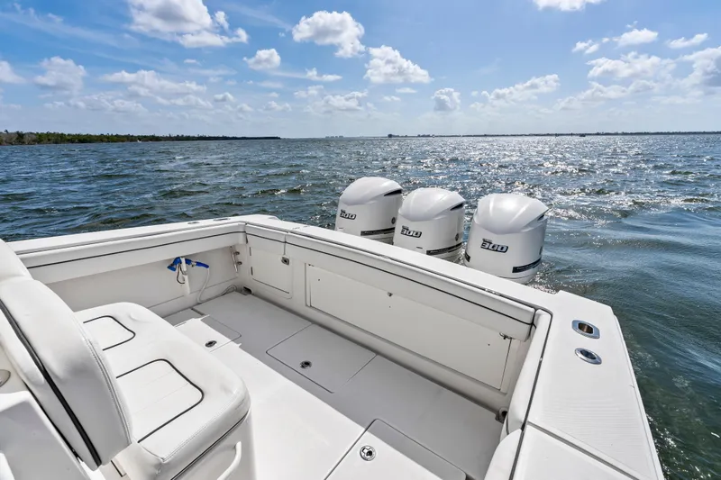 Slide: The Image of 2015 Jupiter 34 HFS boat with triple engines on open water. - 22