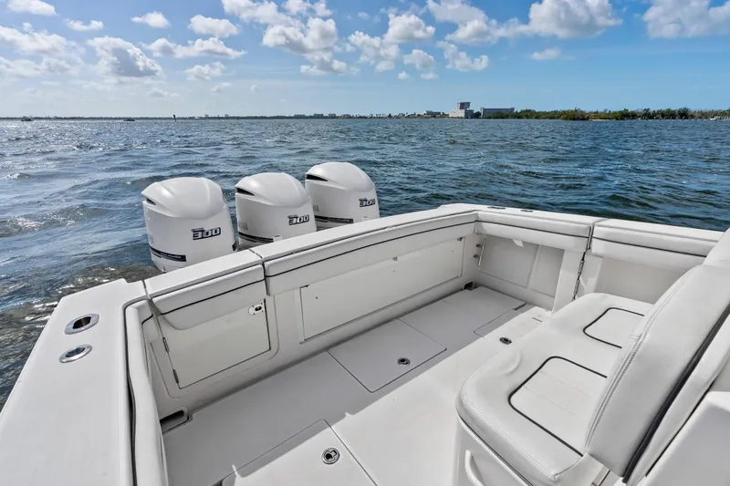 Slide: The Image of 2015 Jupiter 34 HFS boat with triple 300 horsepower engines on open water. - 23