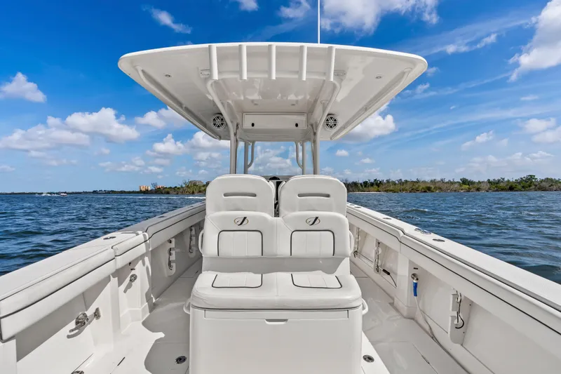 Slide: The Image of 2015 Jupiter 34 HFS boat on open water under blue sky. - 25
