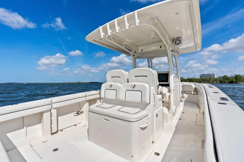 Slide: The Image of 2015 Jupiter 34 HFS boat on open water under clear blue sky. - 26