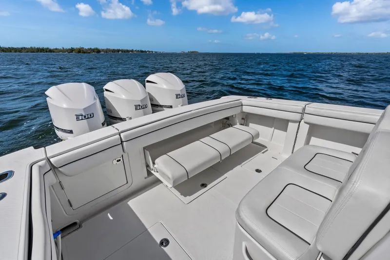 Slide: The Image of 2015 Jupiter 34 HFS boat with triple 300 horsepower engines on open water. - 27