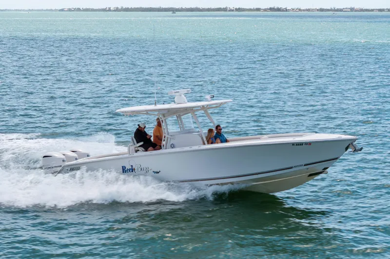 Slide: The Image of 2015 Jupiter 34 HFS boat cruising on open water with passengers onboard. - 7