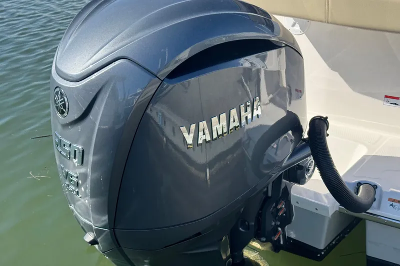 Slide: The Image of Yamaha outboard motor on 2026 Cutwater C-248 Coupe, docked on calm water. - 15