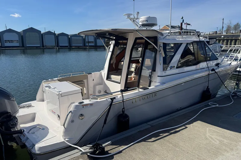 Slide: The Image of 2026 Cutwater C-248 Coupe docked at marina, showcasing sleek design and modern features. - 4