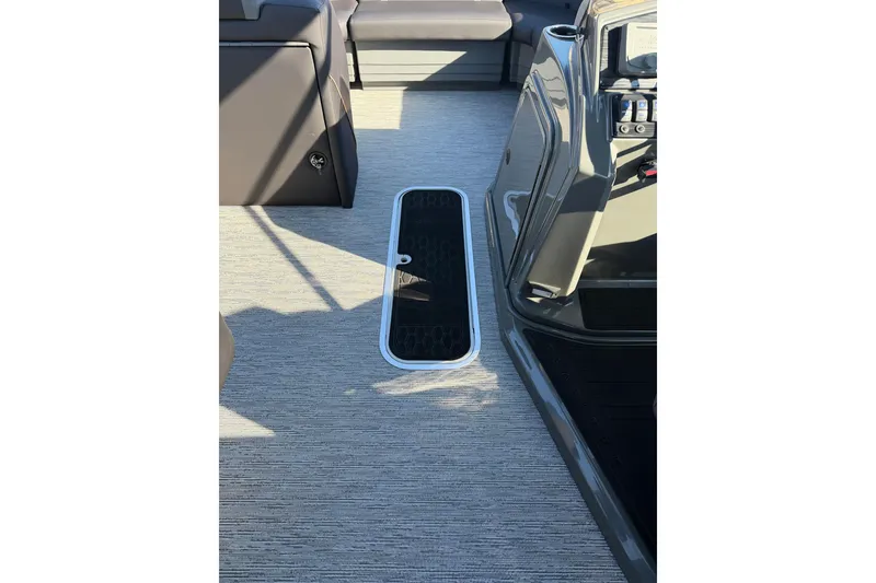 Slide: The Image of Interior view of 2026 Sylvan Mirage X X3 boat, featuring sleek seating and modern flooring. - 10