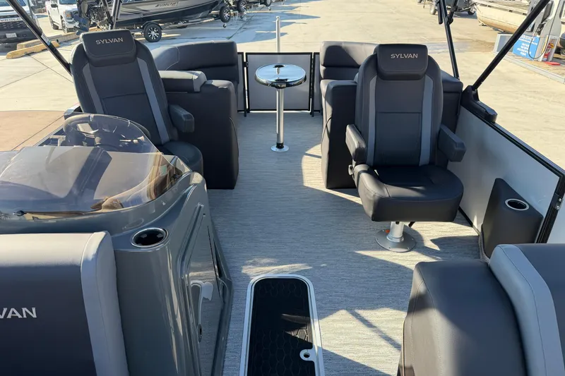 Slide: The Image of Interior of 2026 Sylvan Mirage X X3 pontoon boat with luxurious seating and table. - 12