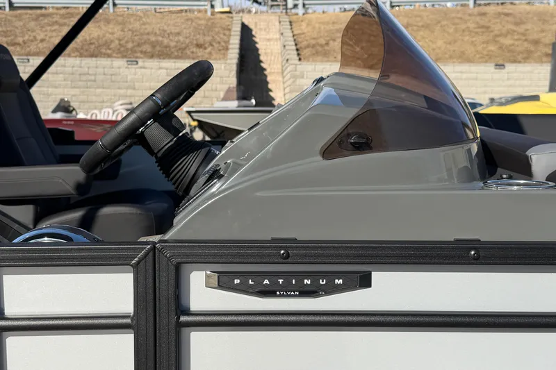 Slide: The Image of 2026 Sylvan Mirage X X3 boat dashboard with steering wheel and windshield. - 16