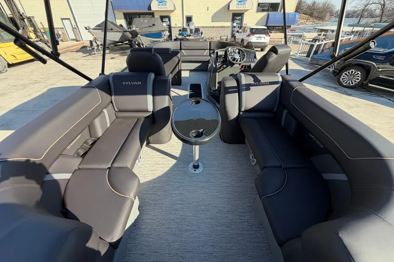 Slide: The Image of 2026 Sylvan Mirage X X3 pontoon boat interior with luxurious seating and modern design. - 7