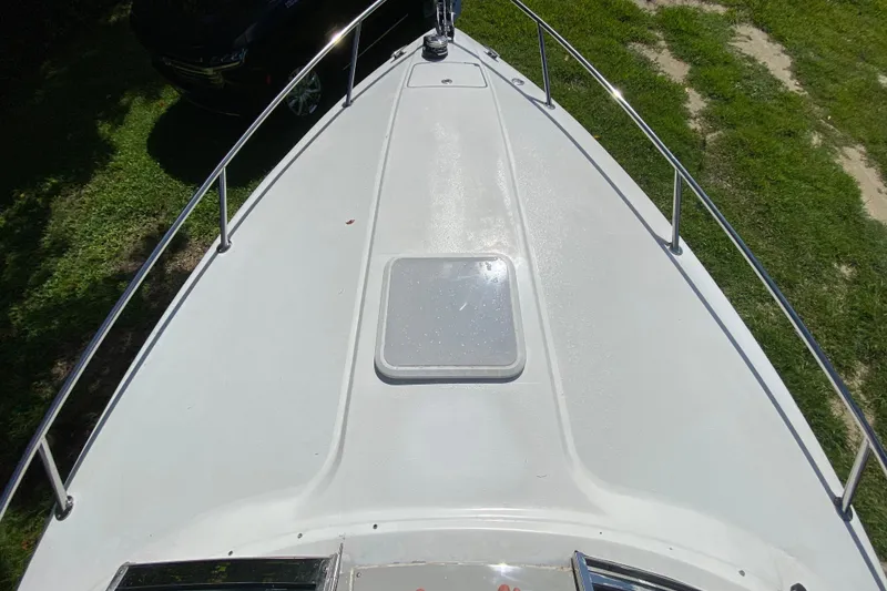 Slide: The Image of 2005 Formula 280 Sun Sport boat deck, featuring sleek design and stainless steel railings. - 23